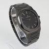 Reloj negro de 2 manecillas plateadas y dial negro