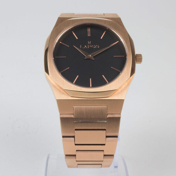 Reloj rosado con 2 manecillas y dial negro