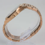 Reloj rosado con 2 manecillas y dial negro