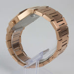 Reloj rosado con 2 manecillas y dial negro