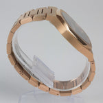 Reloj rosado con 2 manecillas y dial negro