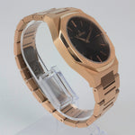 Reloj rosado con 2 manecillas y dial negro
